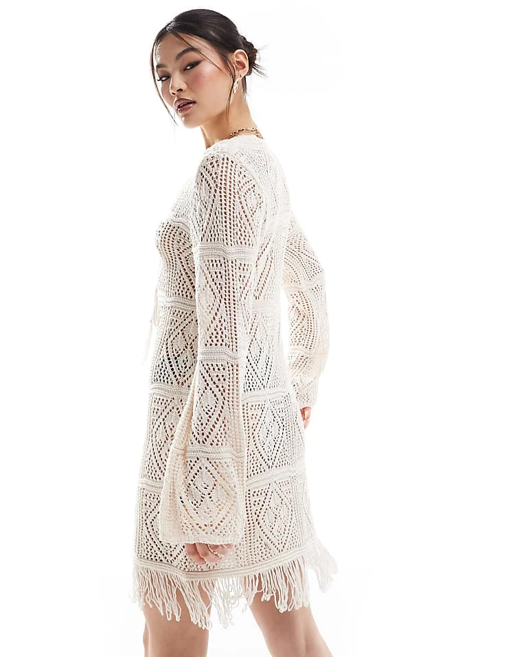 In The Style V Neck Tie Detail Tassel Hem Crochet Mini Beach Dress In Beige For Women 3 In The Style V Neck Tie Detail Tassel Hem Crochet Mini Beach Dress In Beige For Women - Image 3