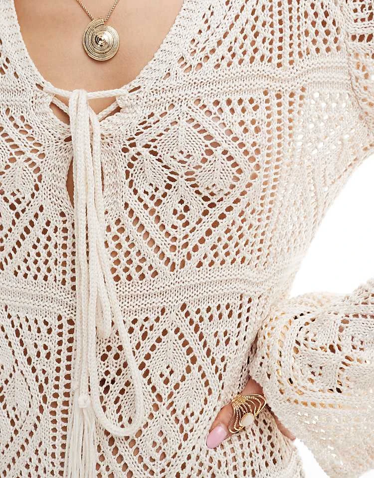 In The Style V Neck Tie Detail Tassel Hem Crochet Mini Beach Dress In Beige For Women 4 In The Style V Neck Tie Detail Tassel Hem Crochet Mini Beach Dress In Beige For Women - Image 4